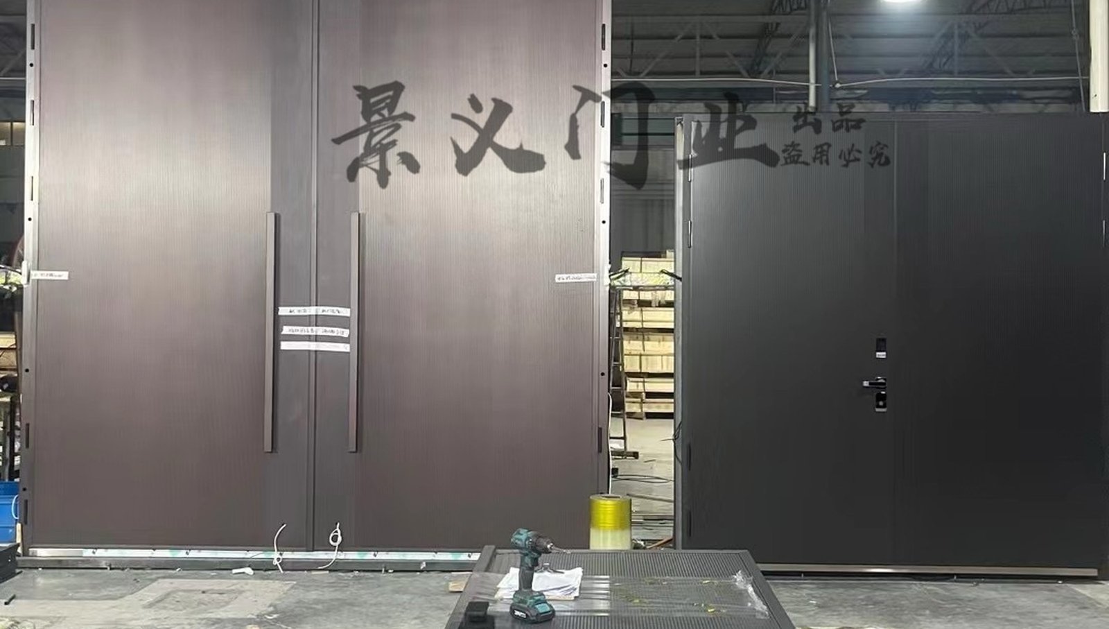 Extra-tall custom entrance doors in the Jingyi Doors workshop